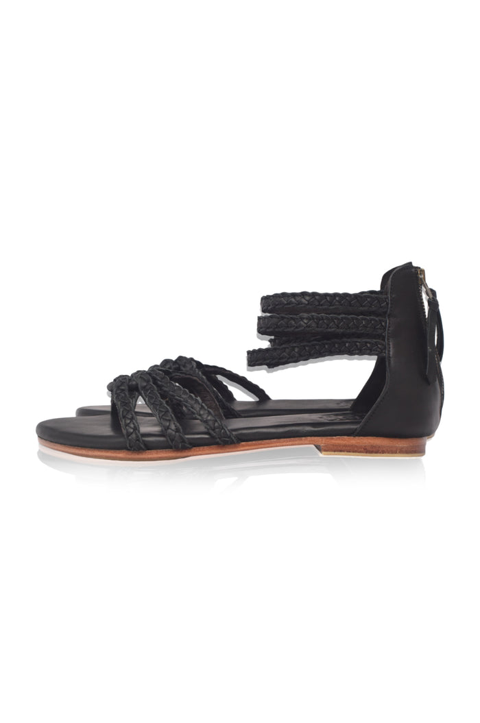 Brown braided leather sandals on a light gray background — handmade by Bali ELF