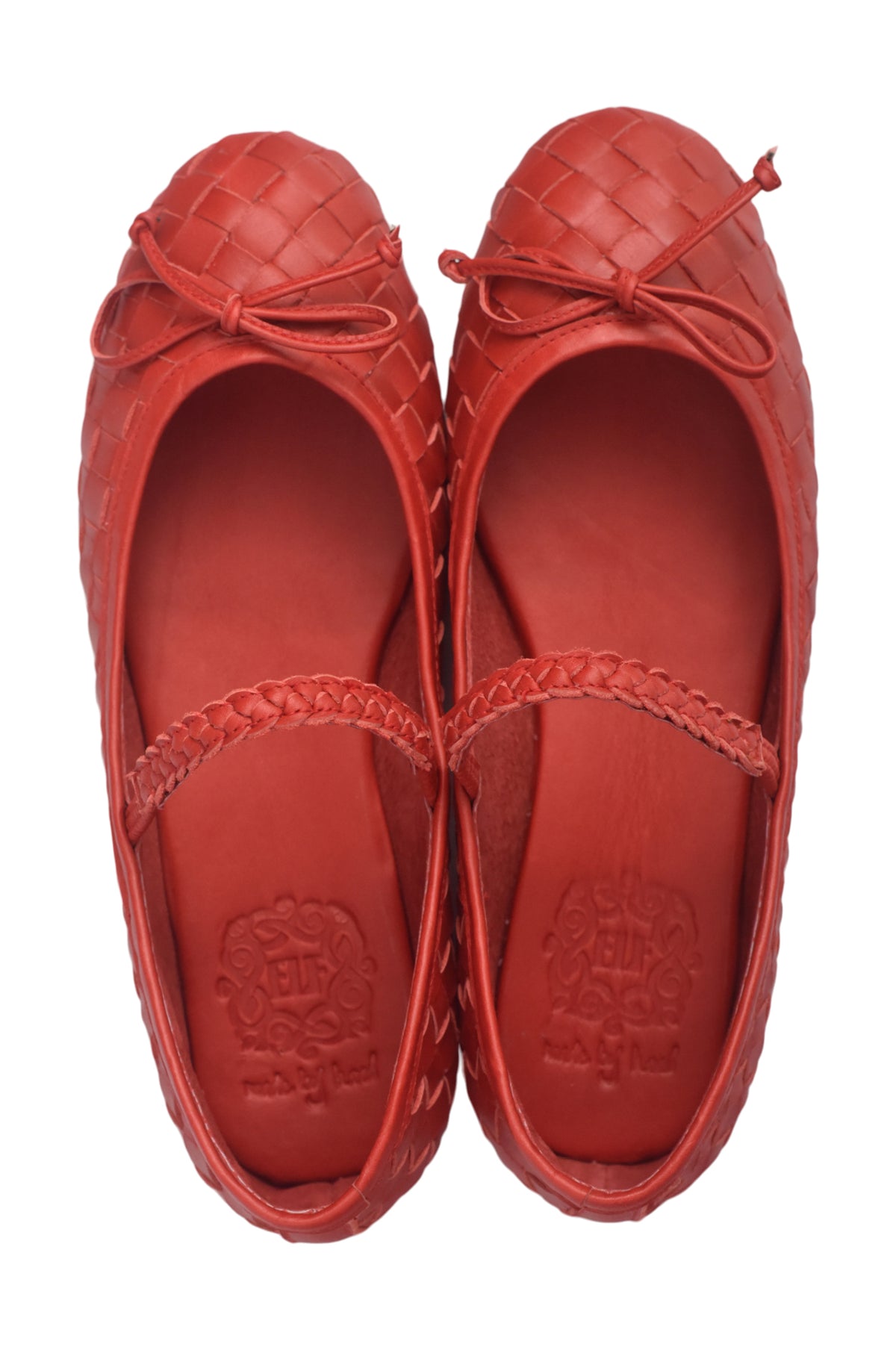A pair of red leather ballet flats with a woven basket-style toe and a thin braided strap across the instep, shown from a top-down view on a white background.