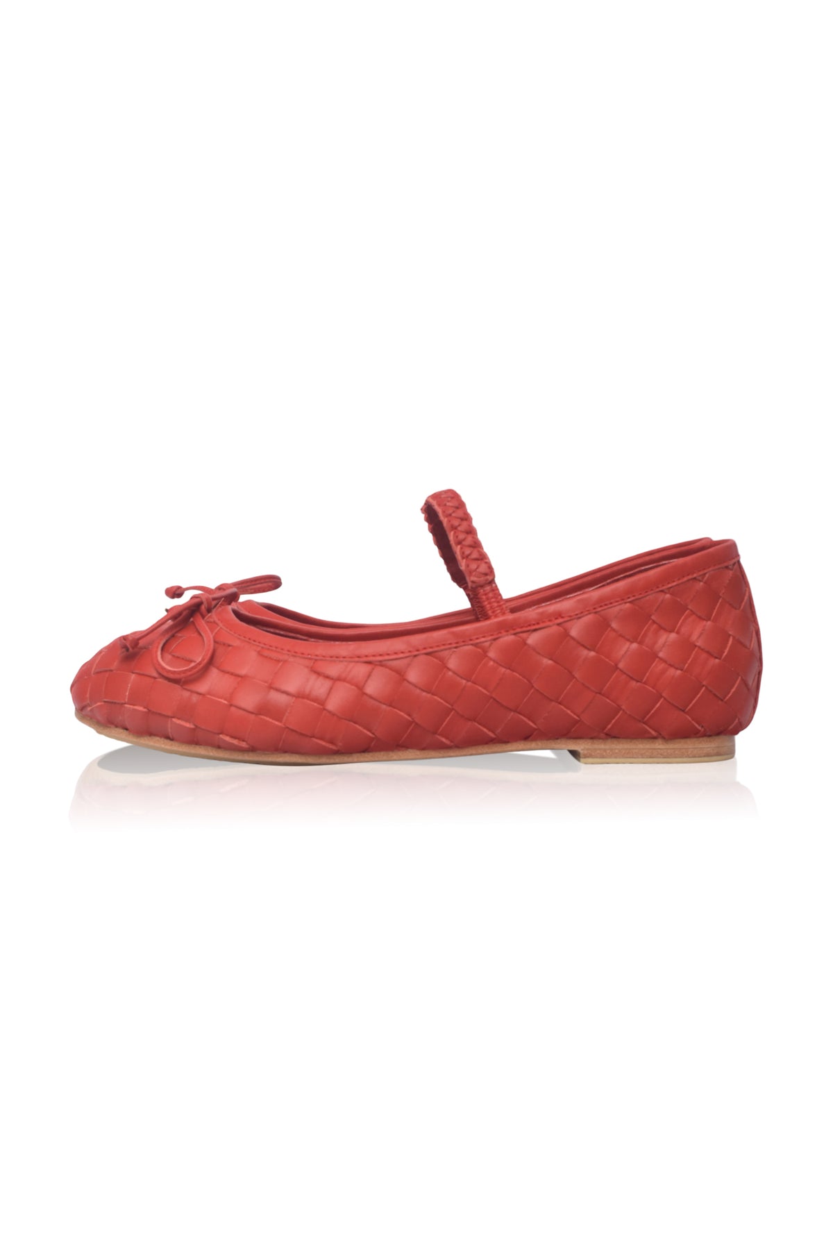 A red woven leather ballet flat with a small bow on the toe and a braided strap, shown in profile against a white background.