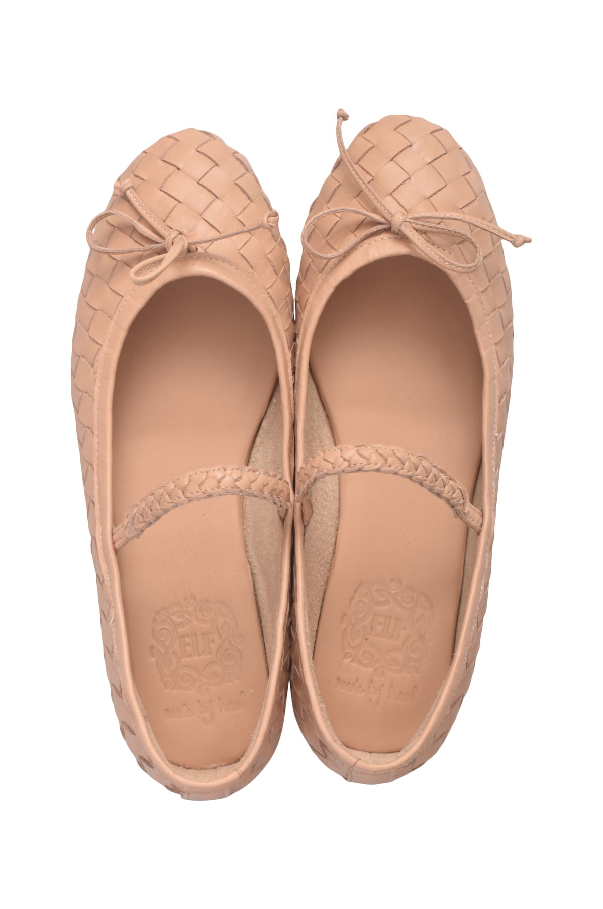 A pair of light tan woven leather ballet flats with bow details on the toes and a thin braided strap across the instep, shown from a top-down view on a white background.