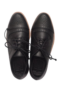 A pair of black leather lace-up oxford shoes with decorative perforated detailing on the toe caps, shown from a top-down view on a white background.