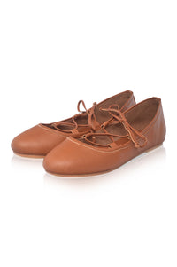 A pair of tan leather lace-up flats with a rounded toe, displayed on a clean white background.