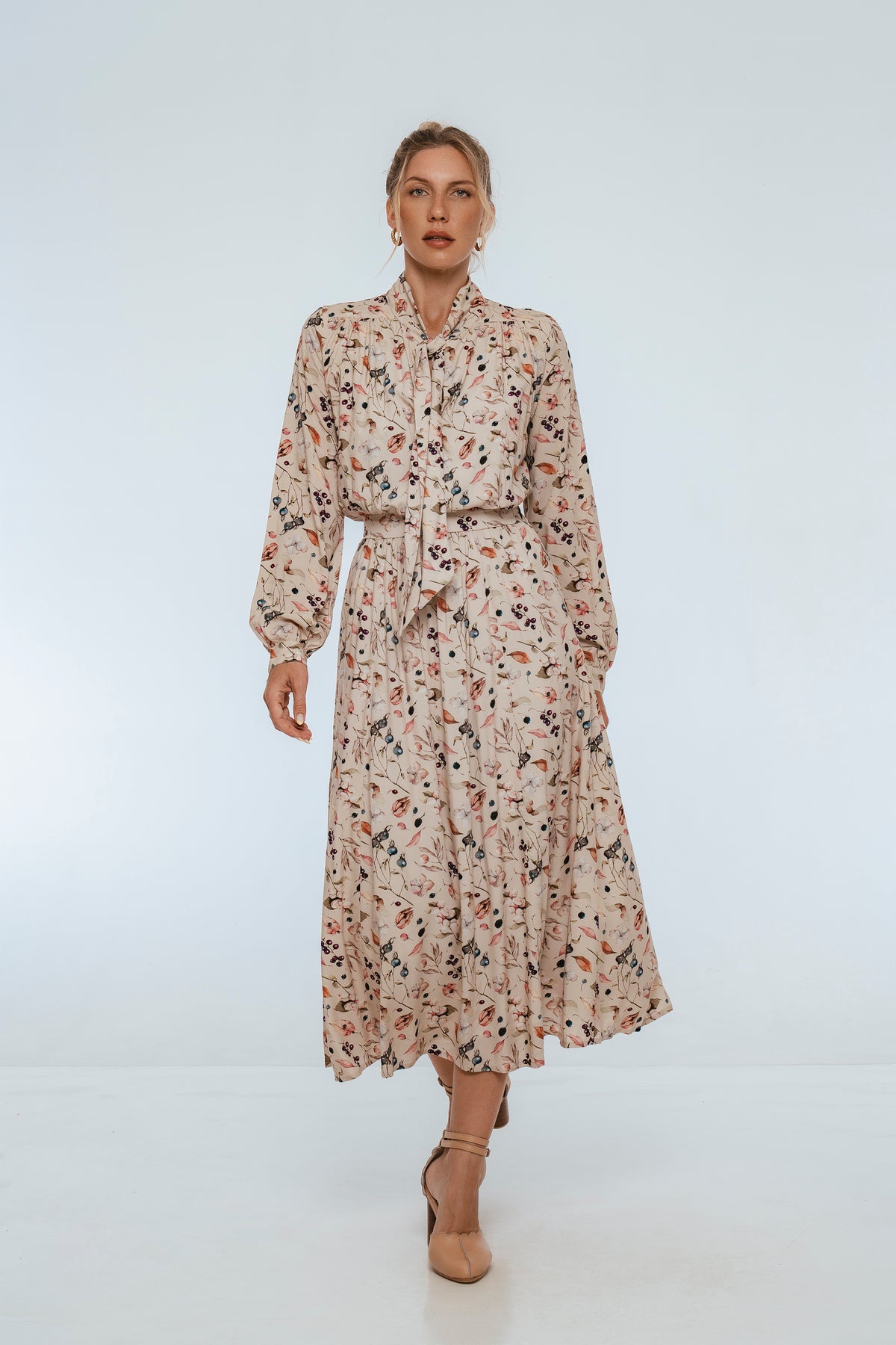 Woman wearing a floral dress on a white background