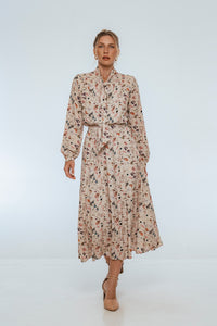 Woman wearing a floral dress on a white background