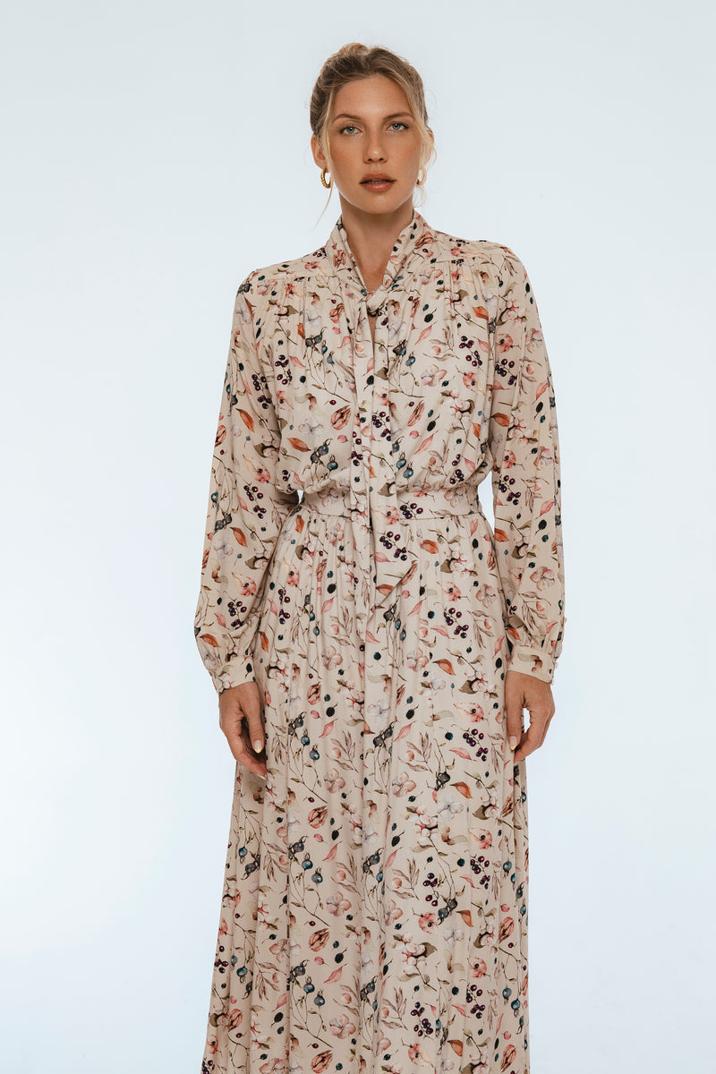 Woman wearing a floral dress on a white background