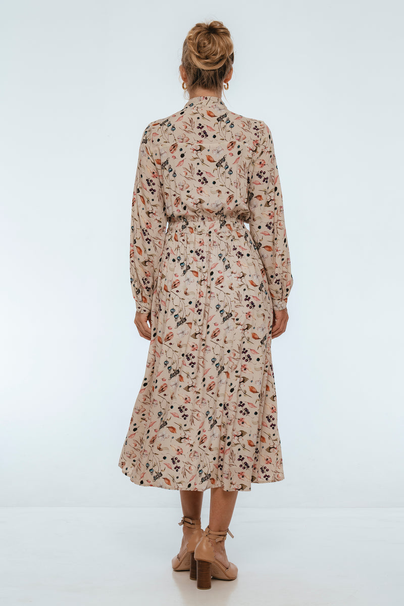 Woman wearing a floral dress on a white background
