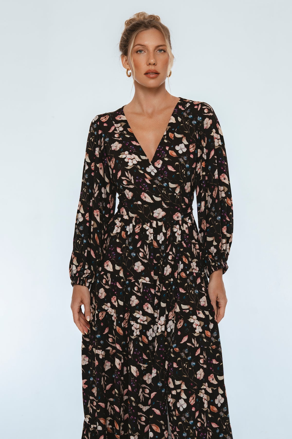 Woman wearing a floral dress on a white background