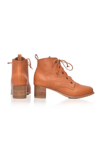 A pair of tan leather lace-up ankle boots with block heels, shown from the side and back on a white background.