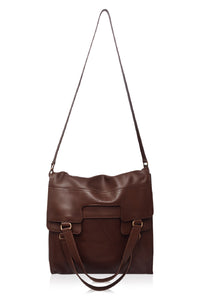 Brown leather handbag with a strap on a white background