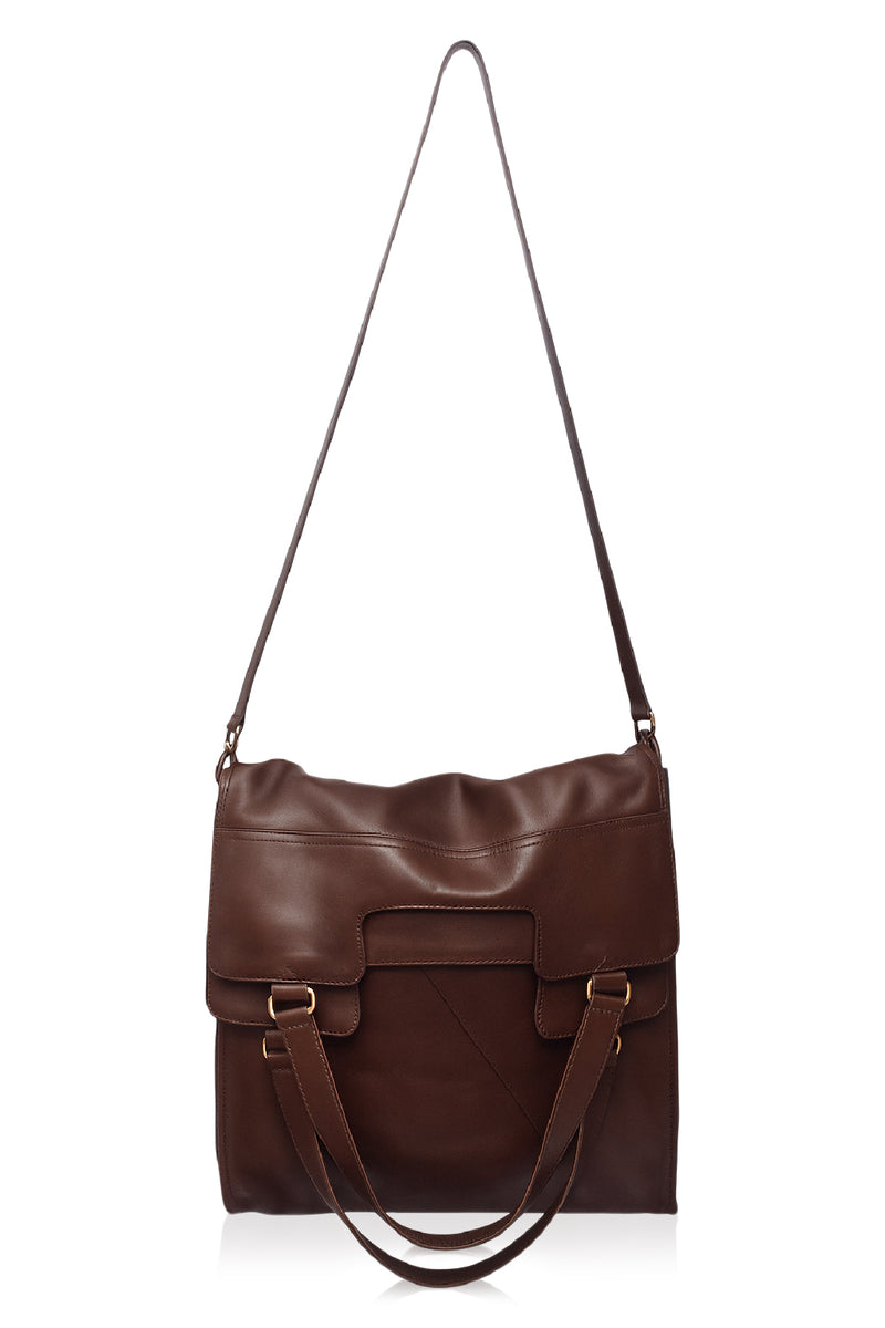 Brown leather handbag with a strap on a white background