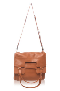 Brown leather bag with a strap on a white background