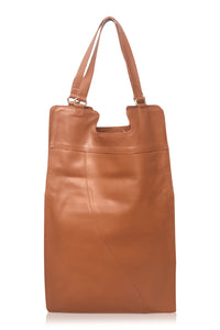 Brown leather tote bag on a white background
