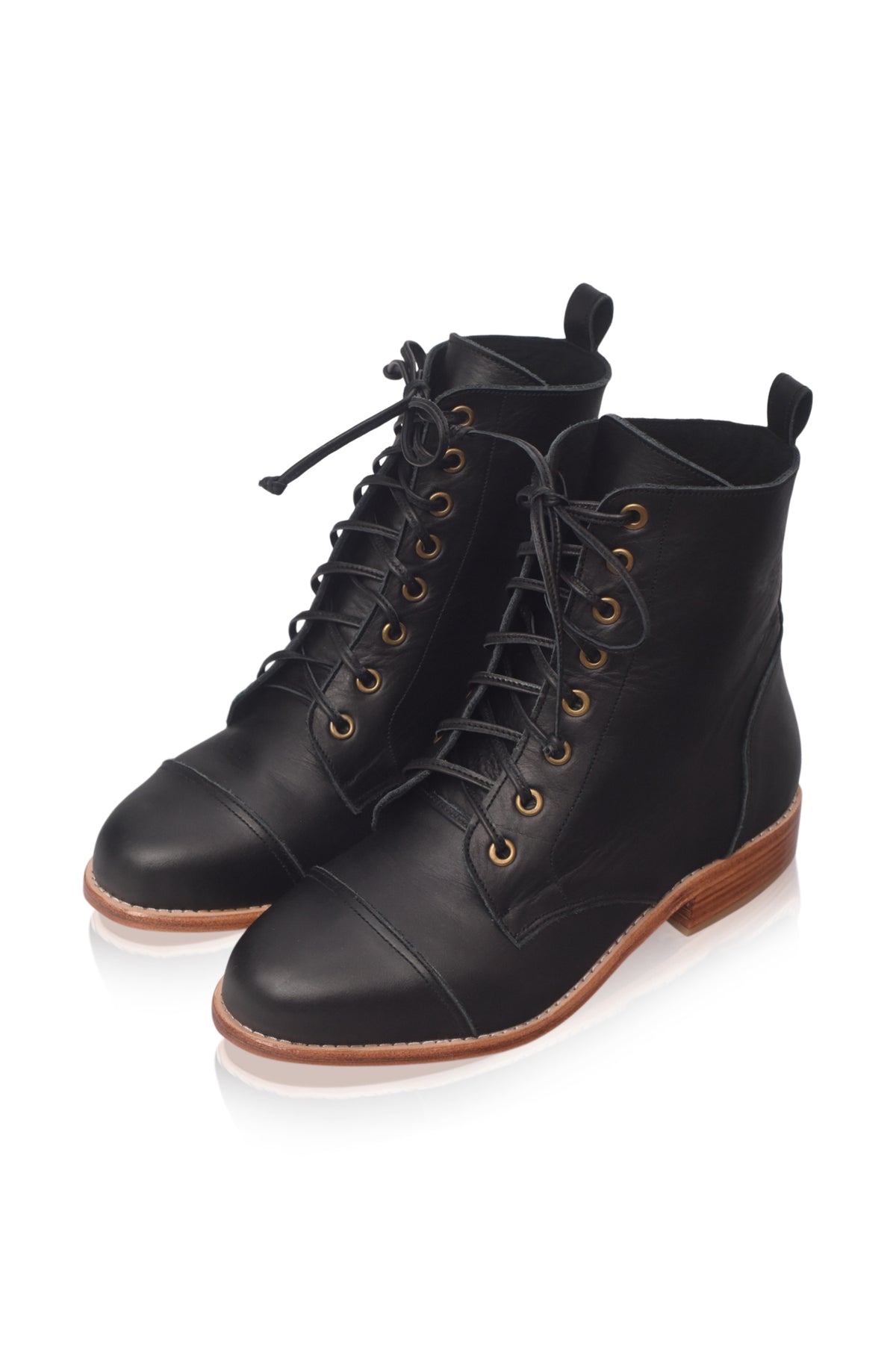 A pair of black leather lace-up ankle boots with gold-tone eyelets and a brown stacked heel, shown on a clean white background.