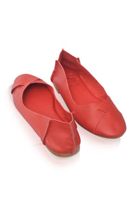 A pair of red leather ballet flats with a pointed toe and a decorative side tab, shown on a white background.