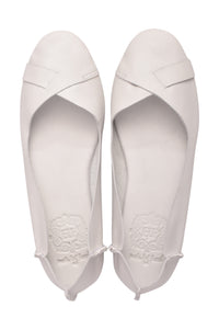 A pair of white leather ballet flats shown from a top-down view on a plain white background.
