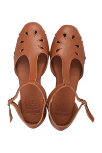 A pair of tan leather cutout sandals with ankle straps, shown from a top-down view on a white background.