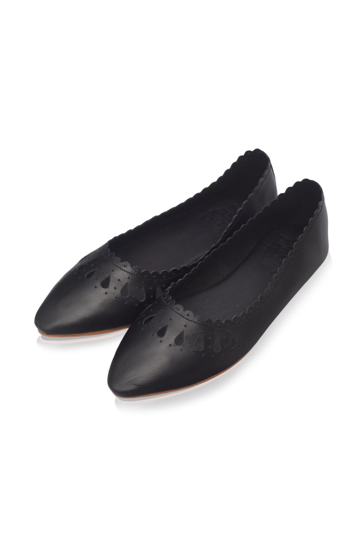 A pair of black pointed-toe flats with decorative cutout detailing on the toe and a scalloped edge, shown on a plain white background.