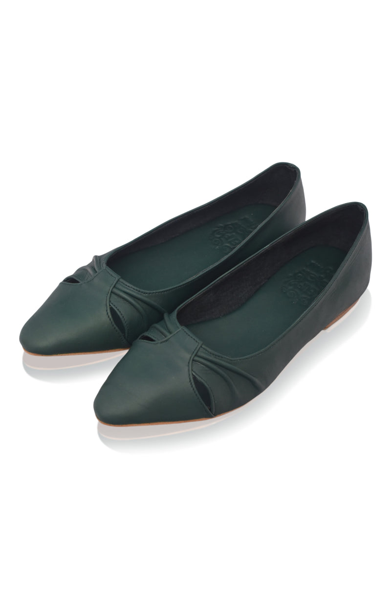 Pair of green flat shoes on a white background