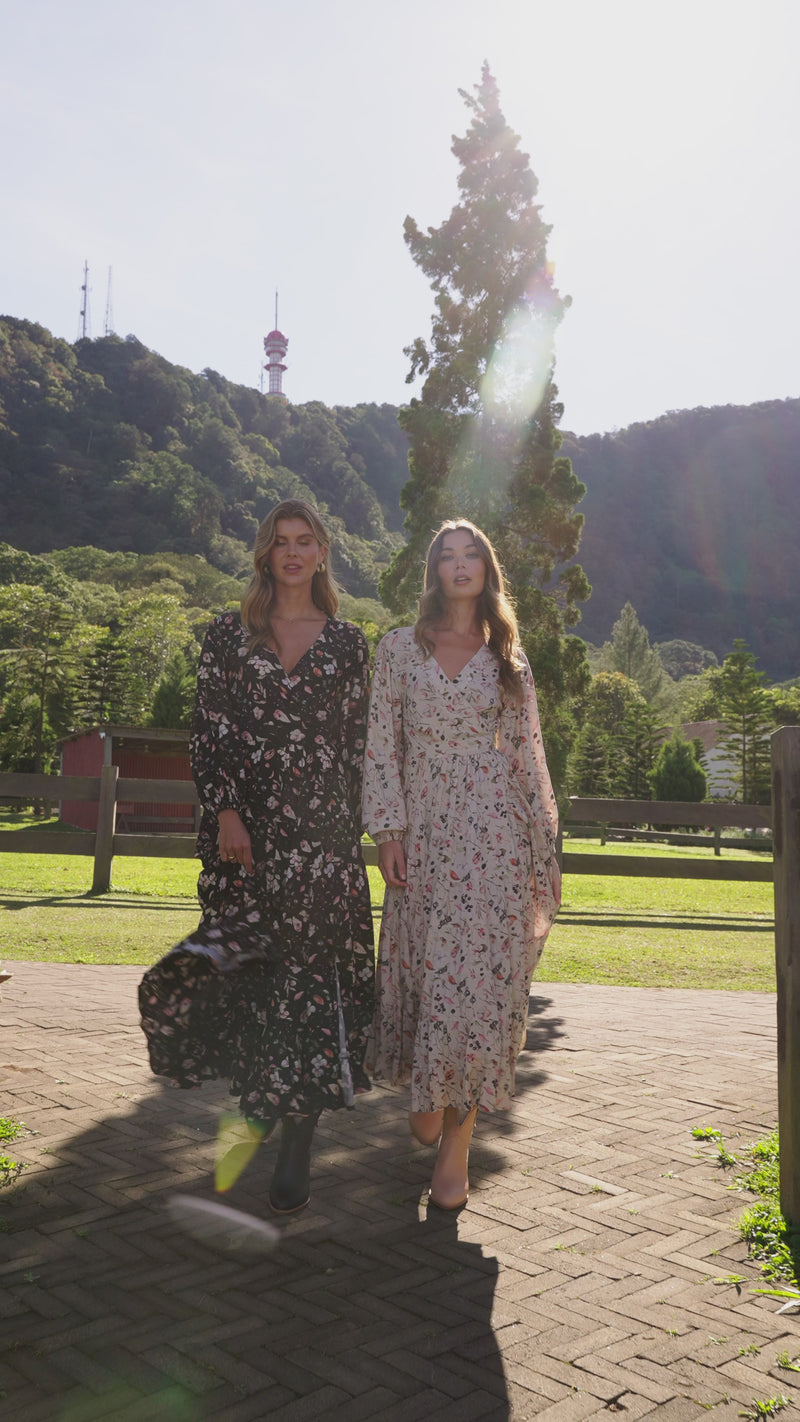 Video of two women wearing beautiful floaty wrap dresses in floral prints